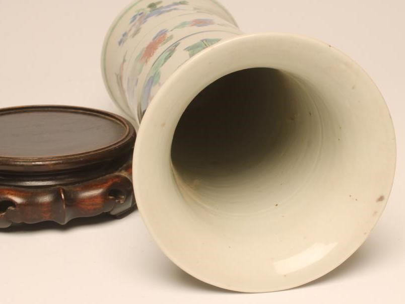 A CHINESE PORCELAIN BEAKER VASE painted in famille verte enamels with figures over fruiting peach Image