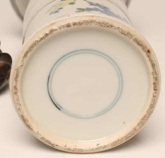 A CHINESE PORCELAIN BEAKER VASE painted in famille verte enamels with figures over fruiting peach Image