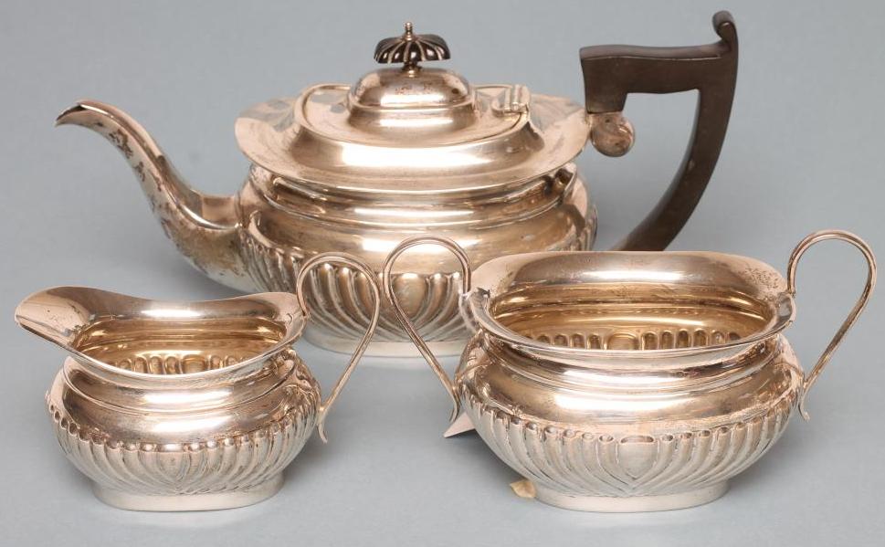 A COMPOSITE THREE PIECE SILVER TEA SERVICE Image