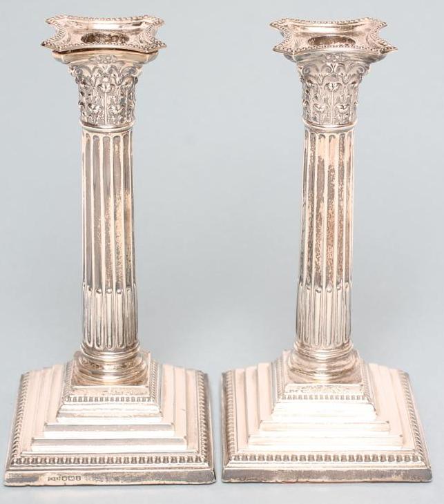 A PAIR OF SILVER CORINTHIAN COLUMN CANDLESTICKS Image