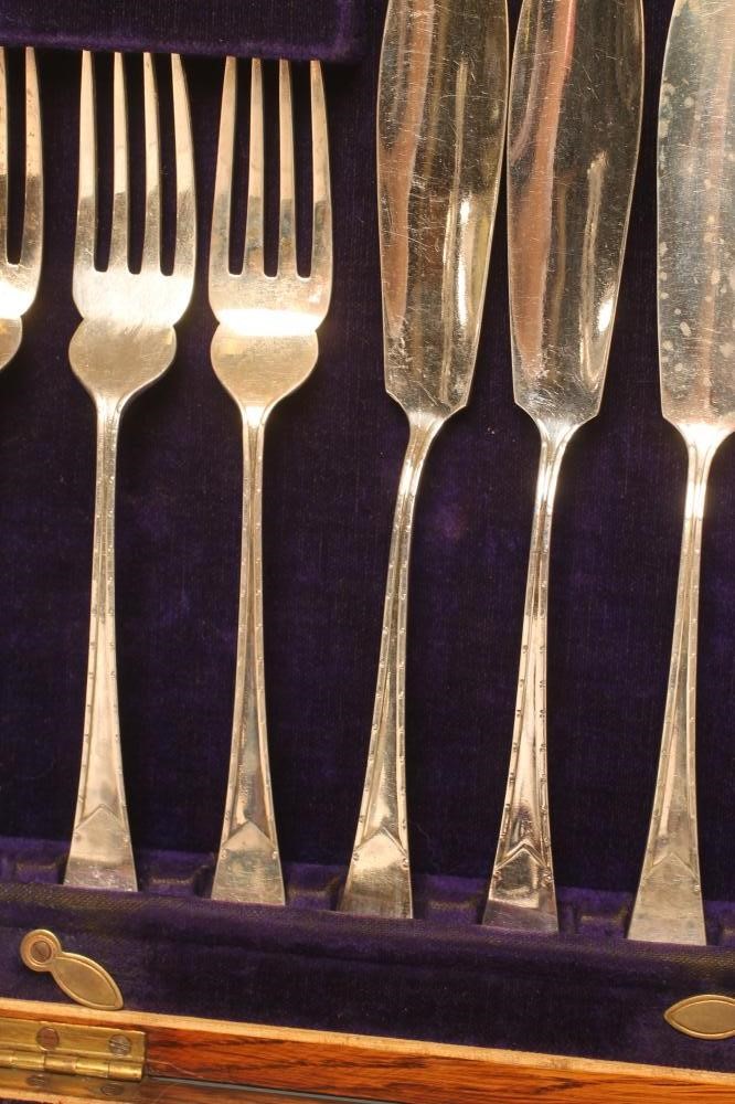*A SET OF TWELVE PAIRS OF SILVER FISH KNIVES AND FORKS Image