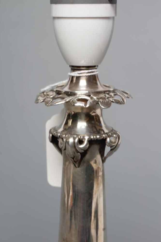 A SILVER ELECTRIC TABLE LAMP BASE Image