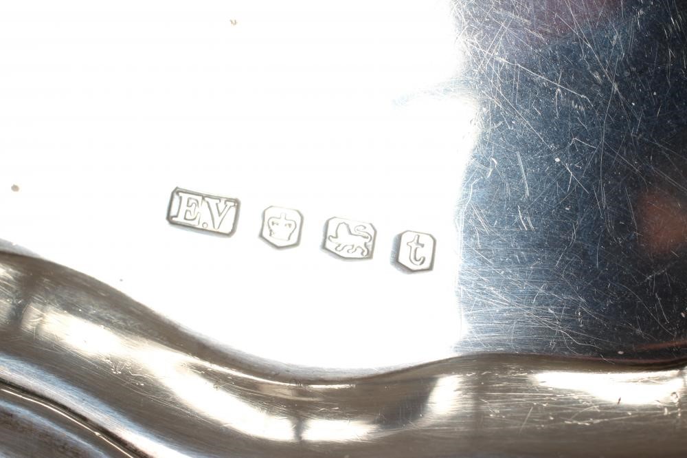 A SMALL SILVER SALVER, by Viners, Sheffield 1936, of shaped circular form with pie-crust rim, raised Image