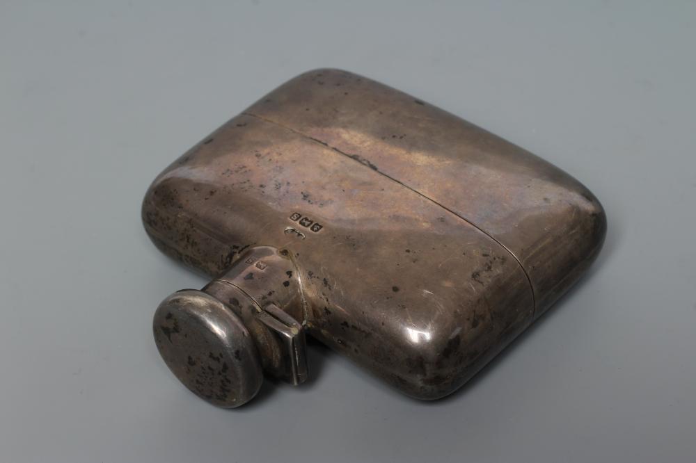 A SILVER HIP FLASK Image