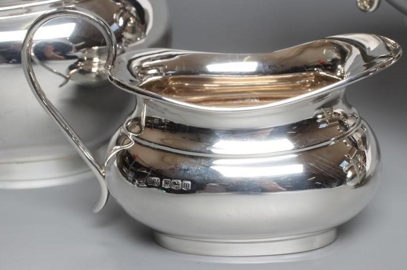 A SILVER FOUR PIECE TEA AND COFFEE SERVICE Image