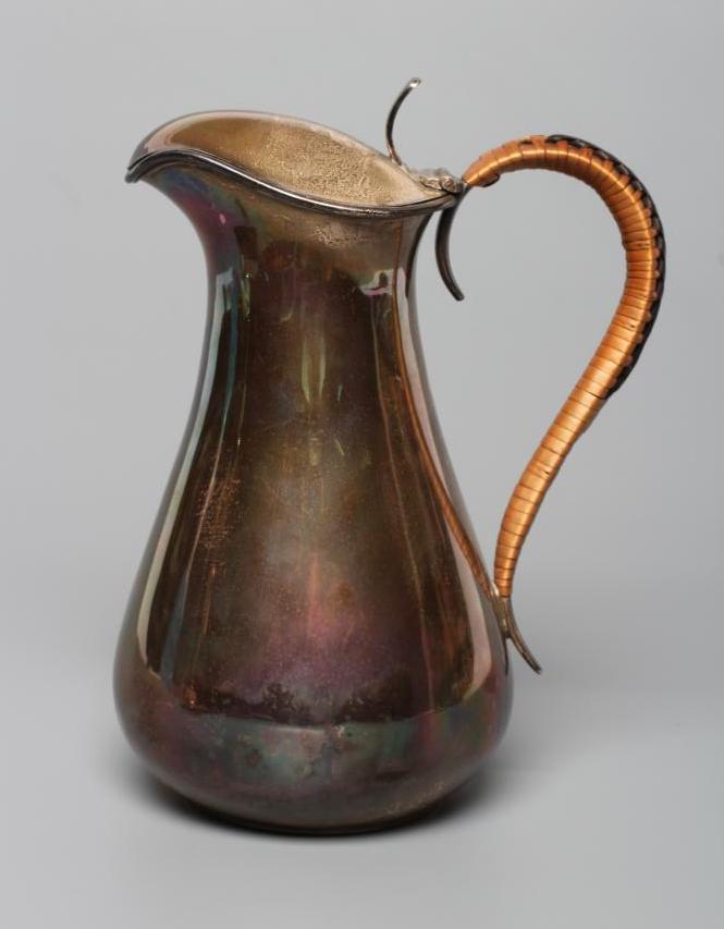 A SILVER HOT WATER JUG Image