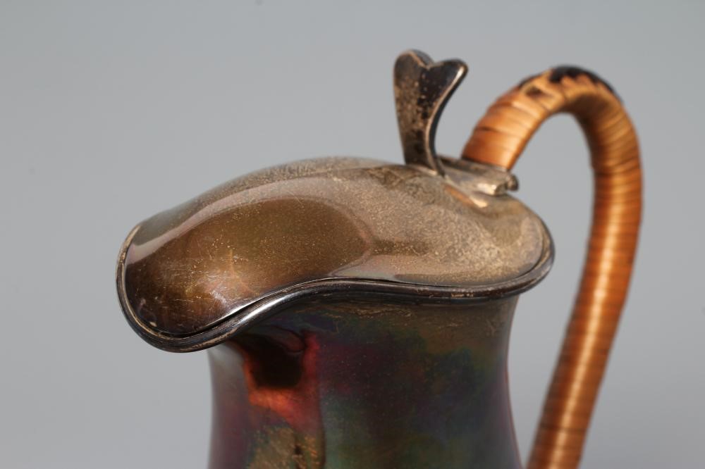 A SILVER HOT WATER JUG Image