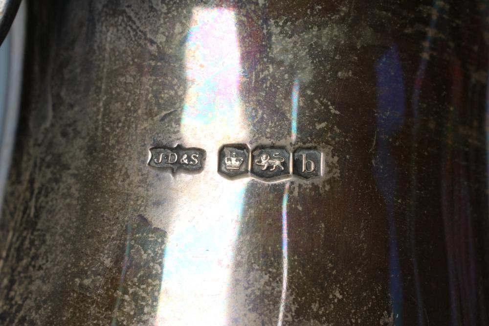 A SILVER HOT WATER JUG Image