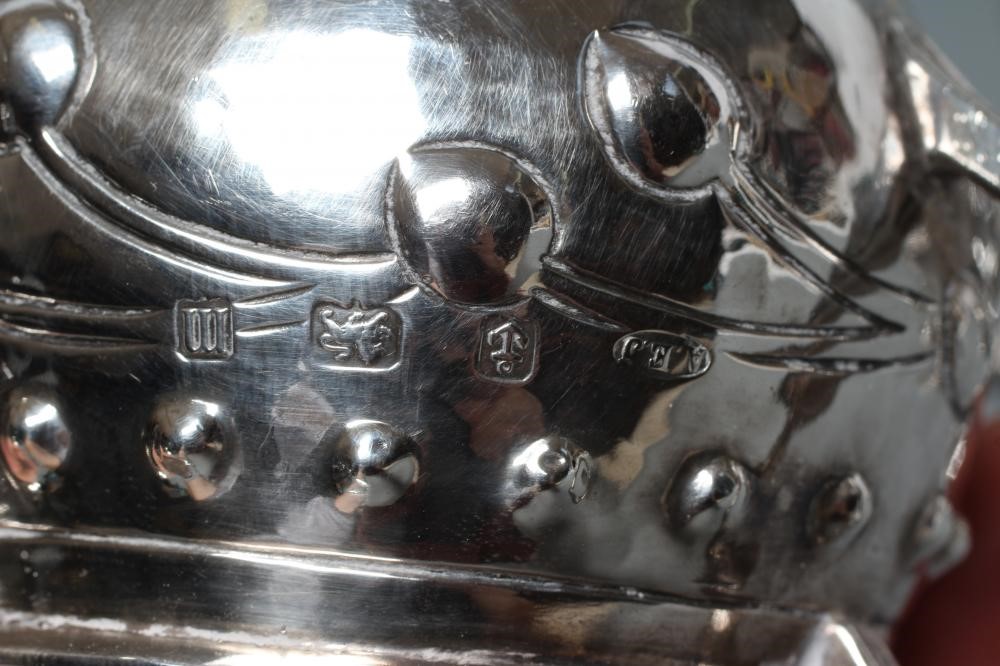 AN EDWARDIAN ARTS AND CRAFTS SILVER THREE PIECE TEA SERVICE Image