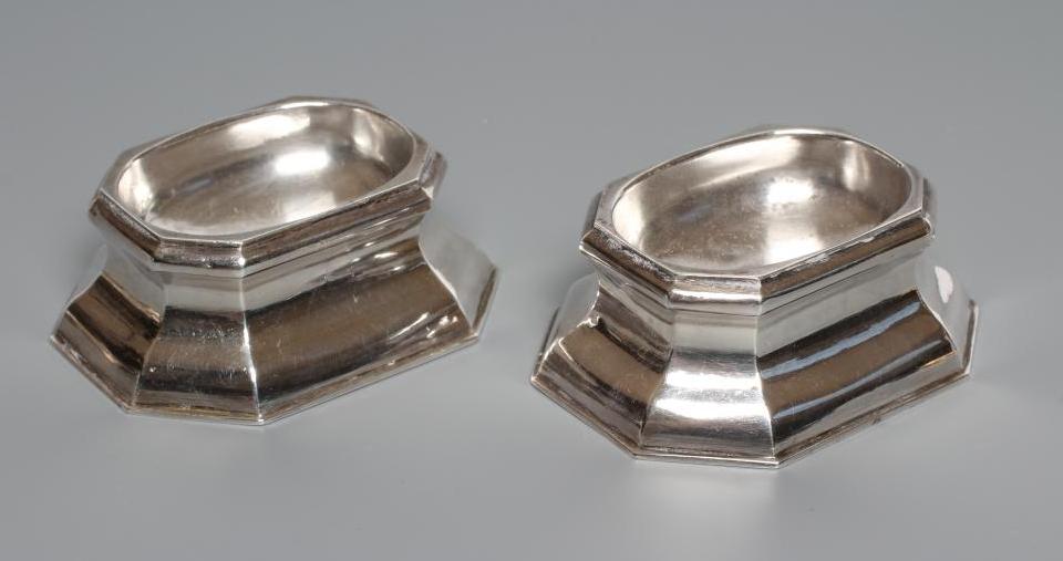 A PAIR OF GEORGE II SILVER TRENCHER SALTS, by Edward Wood, London 1733, of plain swept canted oblong Image