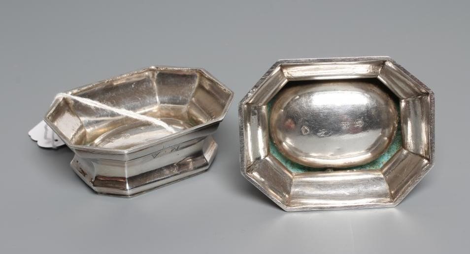 A PAIR OF GEORGE II SILVER TRENCHER SALTS, by Edward Wood, London 1733, of plain swept canted oblong Image