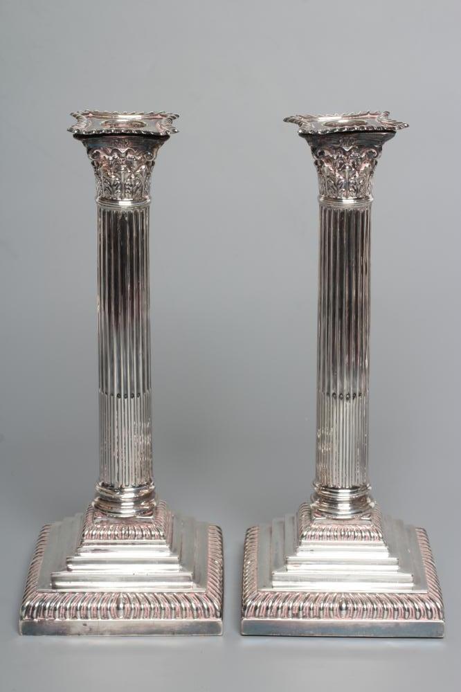 A PAIR OF LATE VICTORIAN SILVER CORINTHIAN COLUMN CANDLESTICKS Image