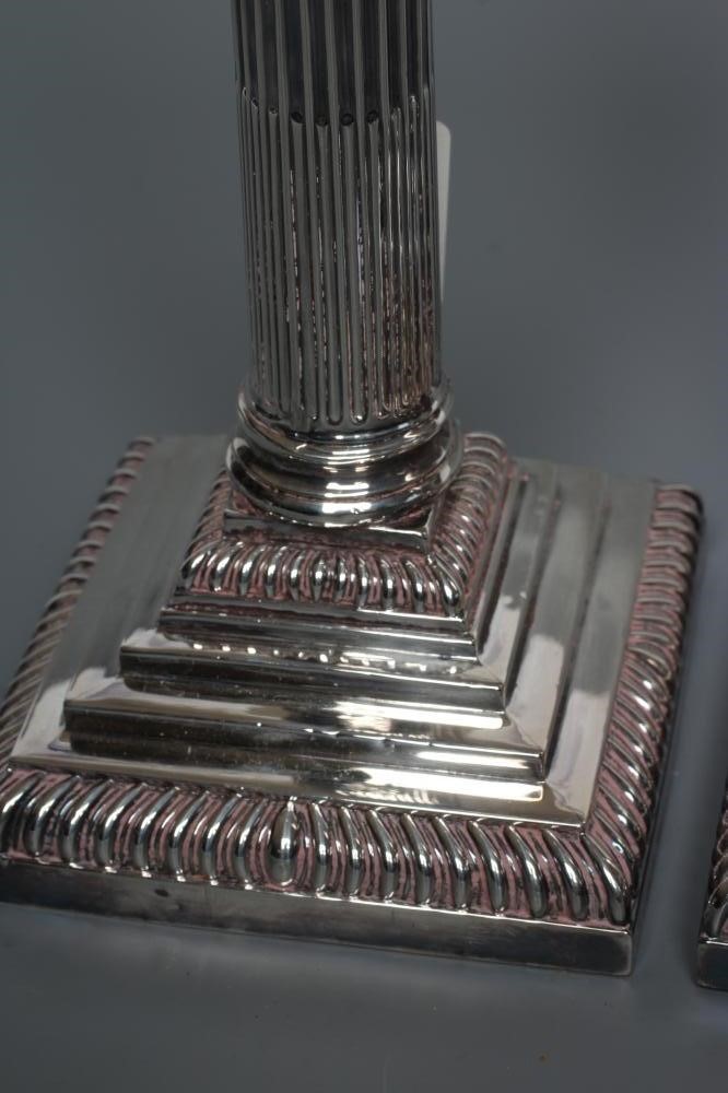 A PAIR OF LATE VICTORIAN SILVER CORINTHIAN COLUMN CANDLESTICKS Image