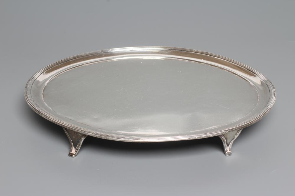 A GEORGE III SILVER OVAL TRAY, by Peter and Ann Bateman, London 1798, with applied reeded rim raised Image