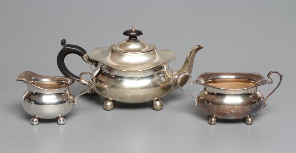 AN EDWARDIAN SILVER THREE PIECE BACHELOR'S TEA SERVICE Image