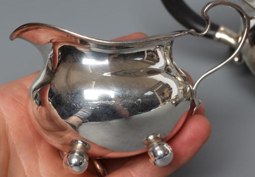 AN EDWARDIAN SILVER THREE PIECE BACHELOR'S TEA SERVICE Image