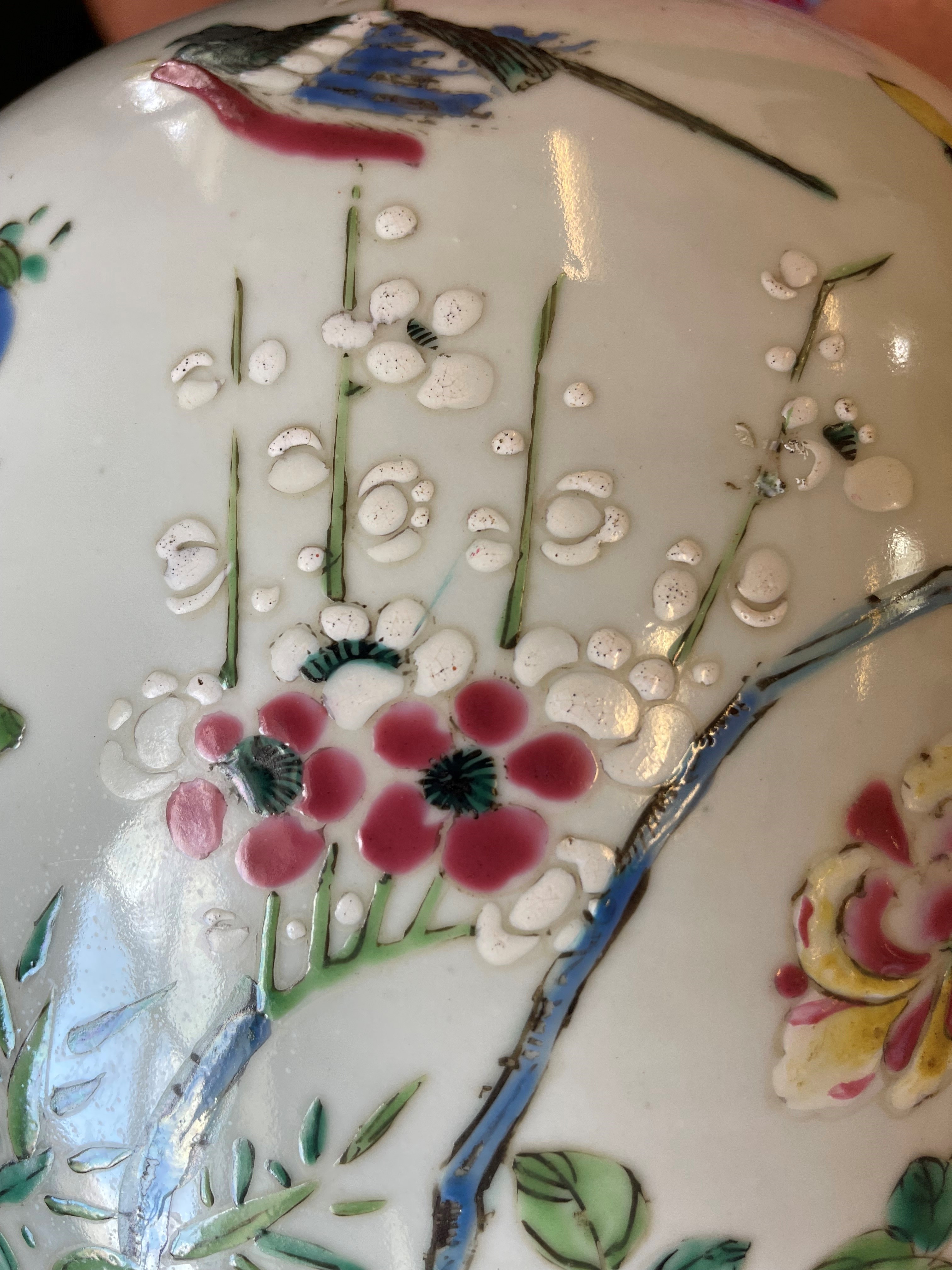 A CHINESE PORCELAIN LARGE JAR AND COVER painted in colours with a finch perched upon a blossoming Image