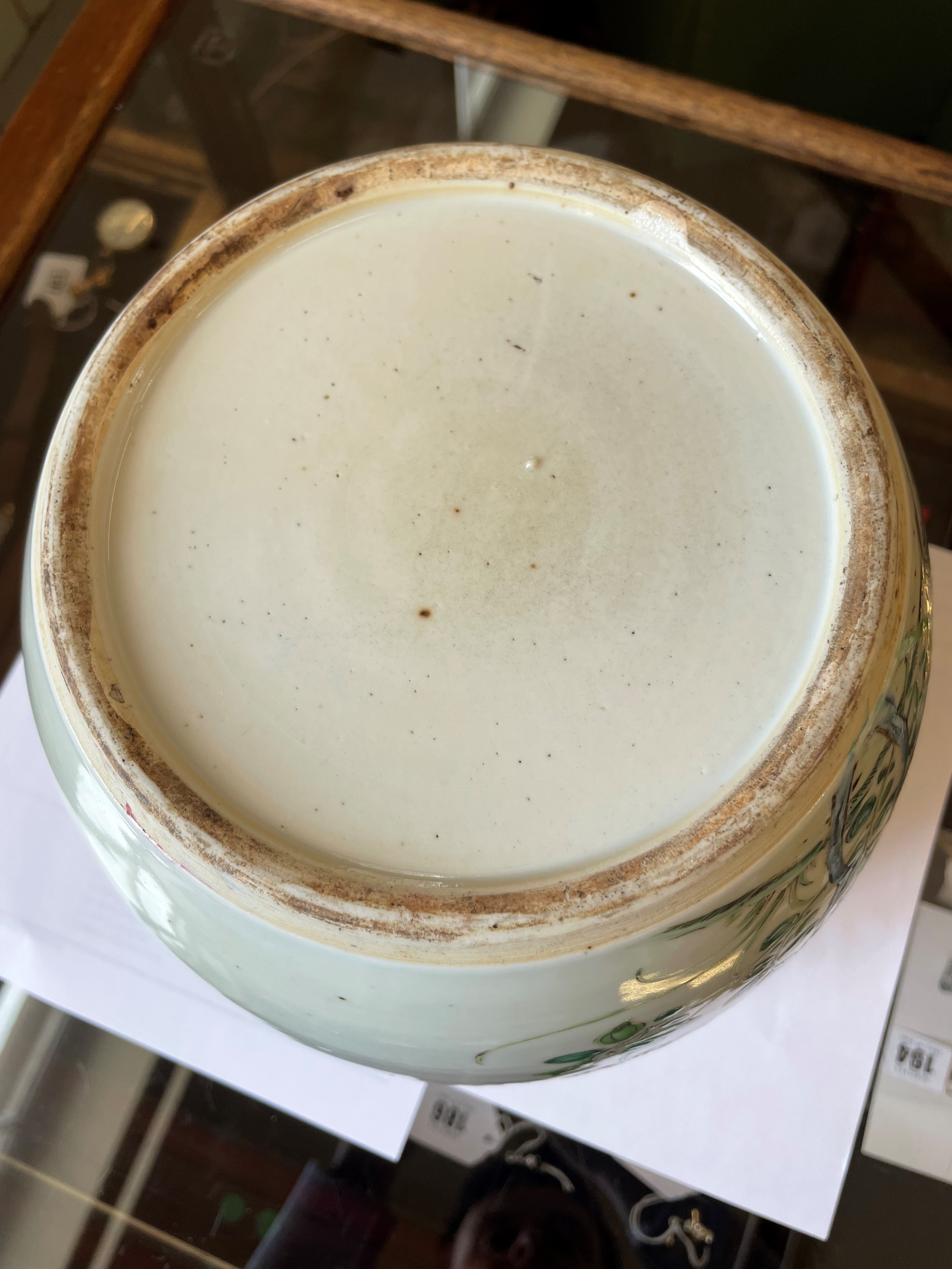 A CHINESE PORCELAIN LARGE JAR AND COVER painted in colours with a finch perched upon a blossoming Image