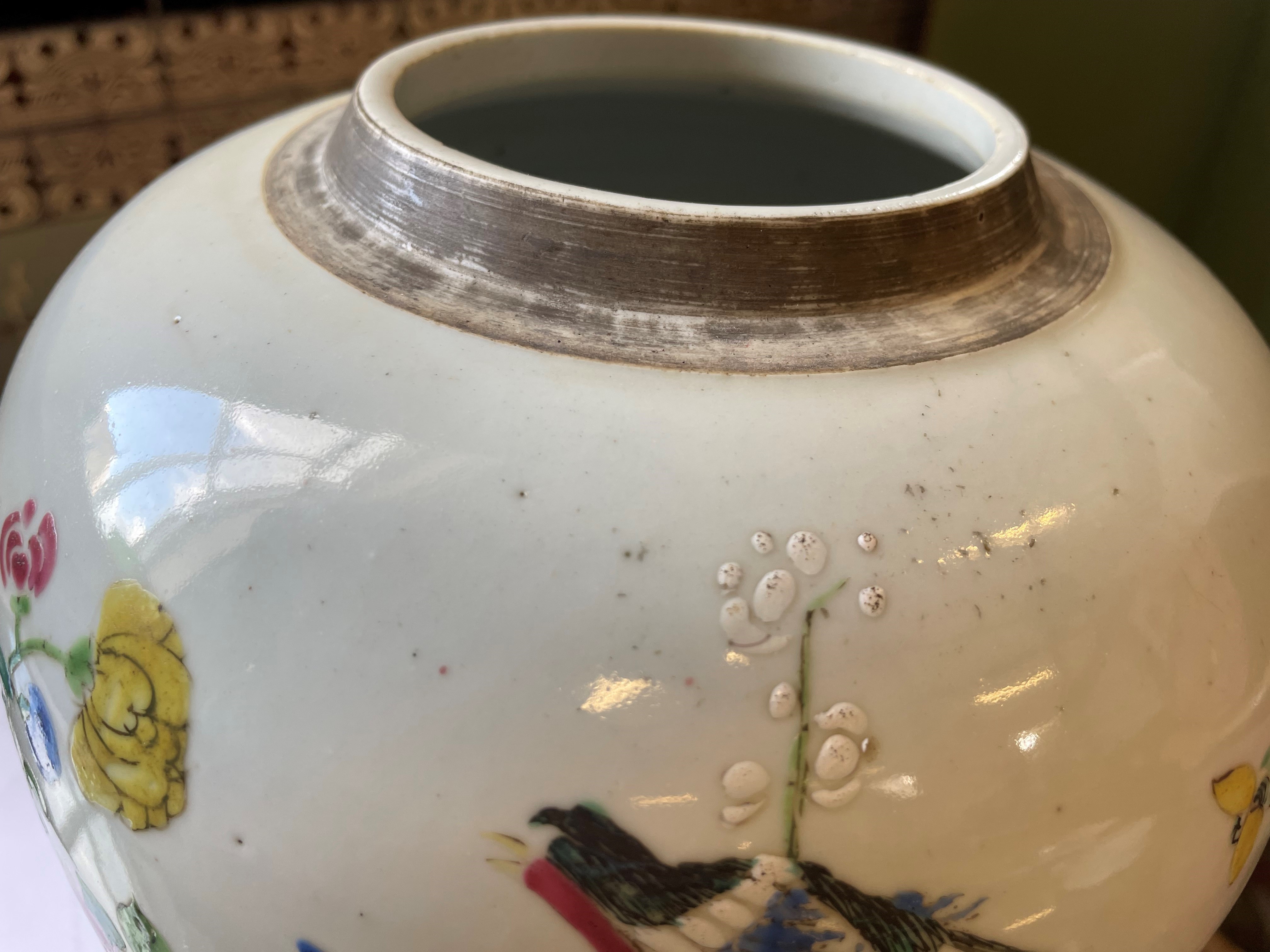 A CHINESE PORCELAIN LARGE JAR AND COVER painted in colours with a finch perched upon a blossoming Image