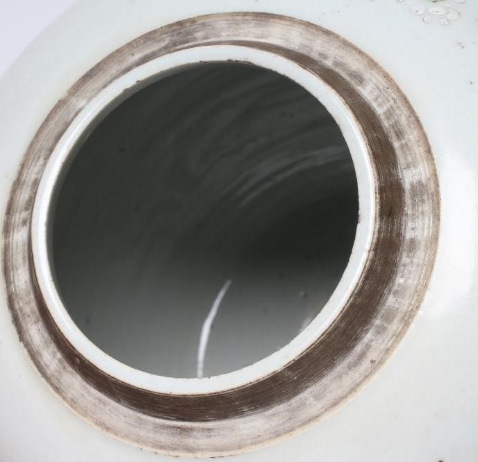 A CHINESE PORCELAIN LARGE JAR AND COVER painted in colours with a finch perched upon a blossoming Image