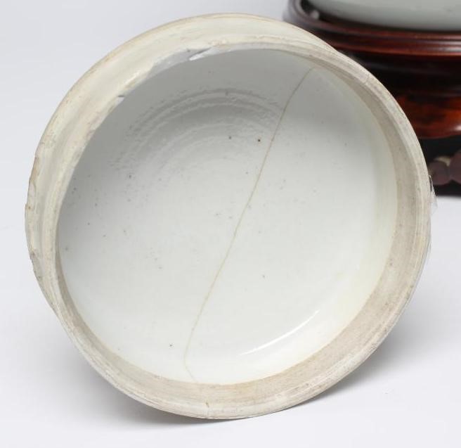 A CHINESE PORCELAIN LARGE JAR AND COVER painted in colours with a finch perched upon a blossoming Image