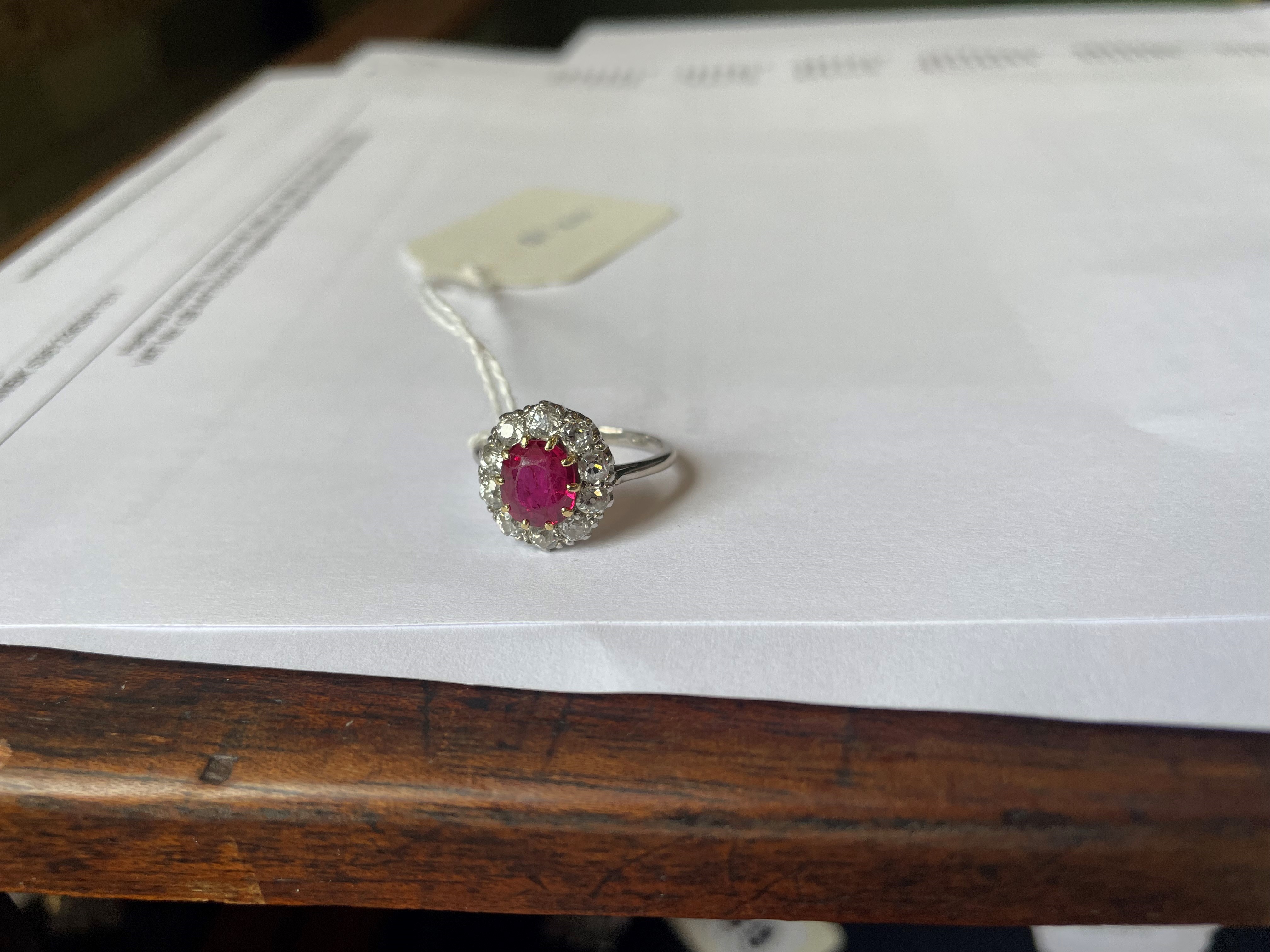 A RUBY AND DIAMOND CLUSTER RING Image