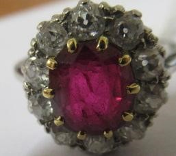 A RUBY AND DIAMOND CLUSTER RING Image
