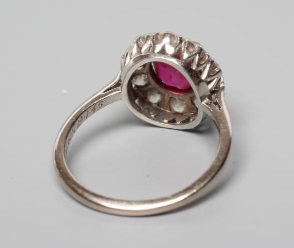 A RUBY AND DIAMOND CLUSTER RING Image