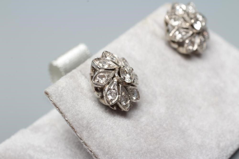 A PAIR OF DIAMOND CLUSTER EAR STUDS Image