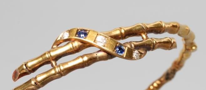A LATE VICTORIAN STIFF HINGED FAUX BAMBOO BANGLE Image