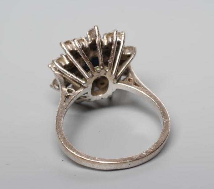 A SAPPHIRE AND DIAMOND CLUSTER RING Image