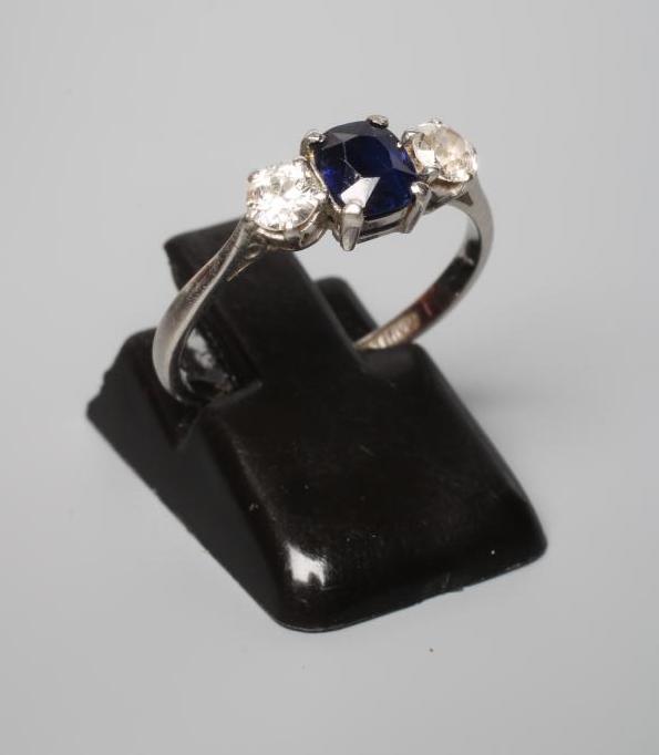 A SAPPHIRE AND DIAMOND THREE STONE RING Image