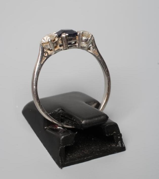 A SAPPHIRE AND DIAMOND THREE STONE RING Image