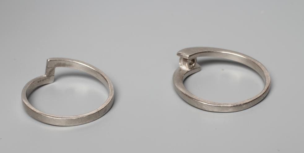 A PALLADIUM DIAMOND ENGAGEMENT AND MATCHING WEDDING RINGS Image