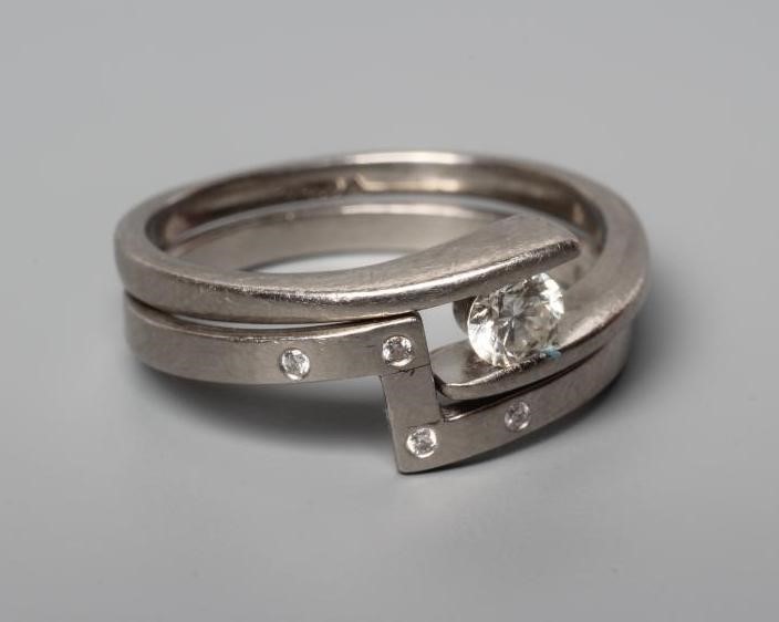 A PALLADIUM DIAMOND ENGAGEMENT AND MATCHING WEDDING RINGS Image
