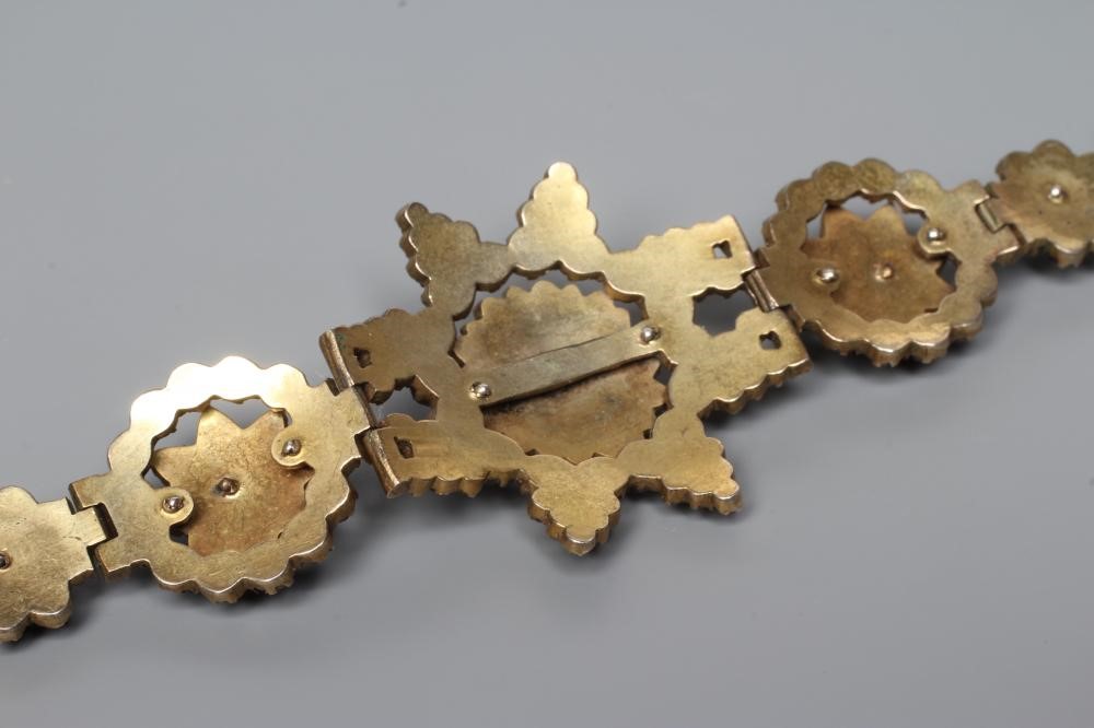 A LATE XIX CENTURY BOHEMIAN GARNET BRACELET, the central star panel hinged to smaller clusters on a Image
