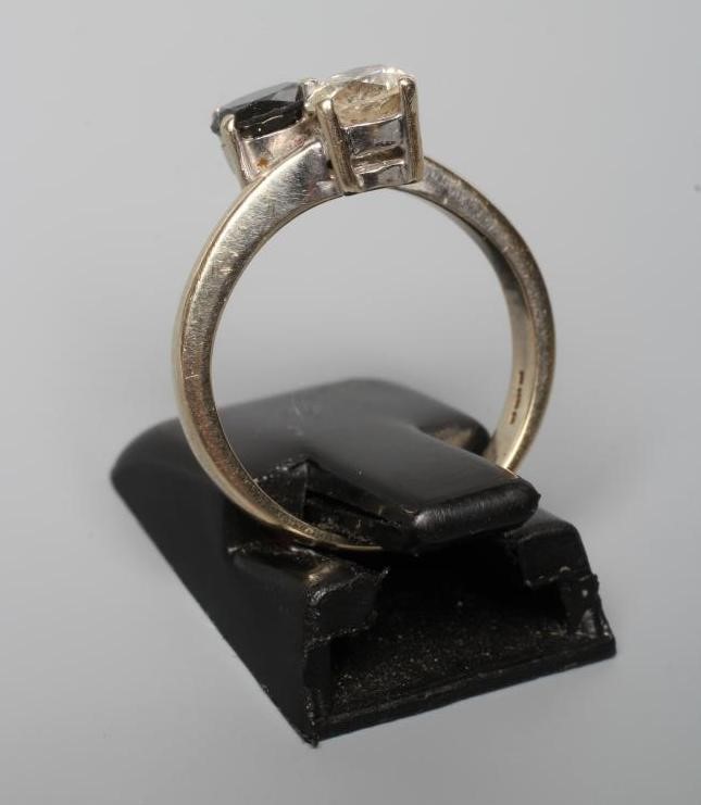 A DIAMOND TWO STONE CROSSOVER RING, Image