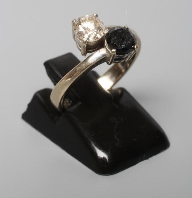 A DIAMOND TWO STONE CROSSOVER RING, Image