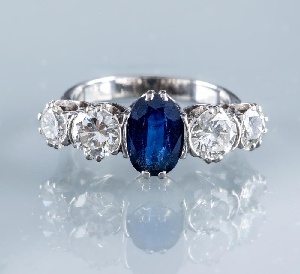 A SAPPHIRE AND DIAMOND FIVE STONE HALF HOOP RING Image