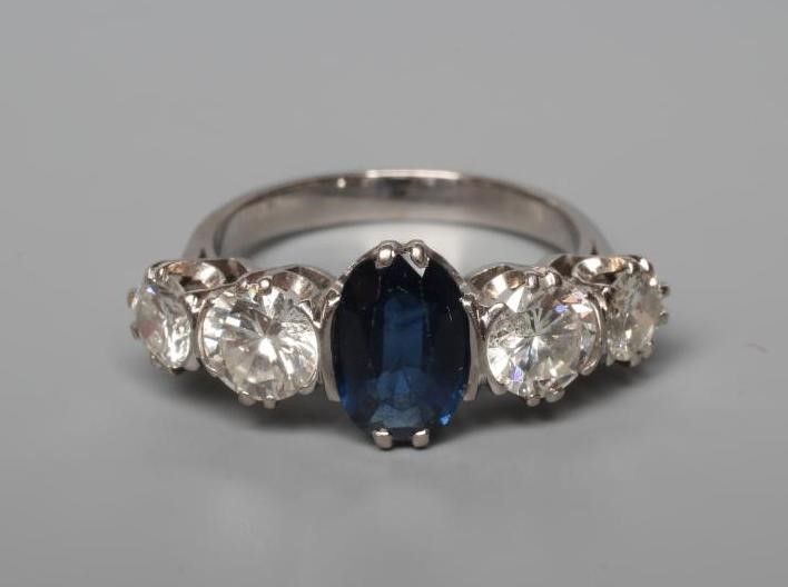 A SAPPHIRE AND DIAMOND FIVE STONE HALF HOOP RING Image
