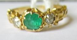 AN EMERALD AND DIAMOND RING Image