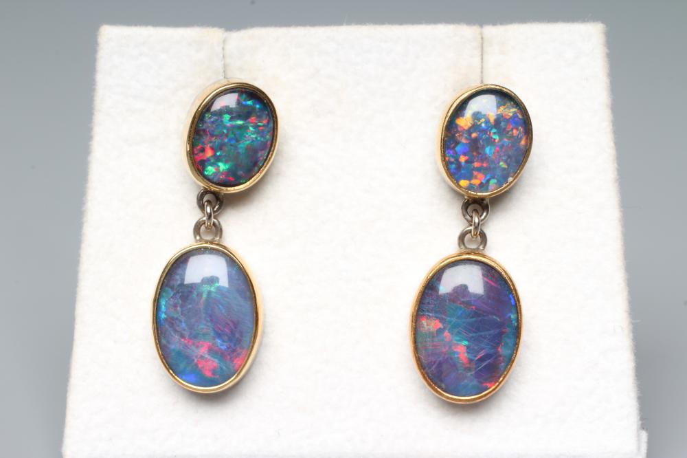 A PAIR OF BLACK OPAL STUD EAR DROPS, the two graduated oval polished cabochons link tied to screw Image