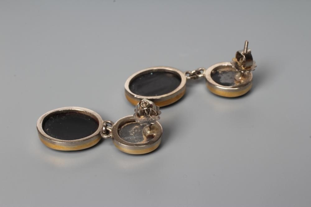 A PAIR OF BLACK OPAL STUD EAR DROPS, the two graduated oval polished cabochons link tied to screw Image