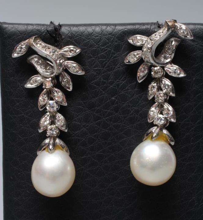A PAIR OF PEARL AND DIAMOND EARRINGS, the cultured pearls pendant from a leafy branch to unmarked Image