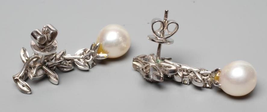 A PAIR OF PEARL AND DIAMOND EARRINGS, the cultured pearls pendant from a leafy branch to unmarked Image