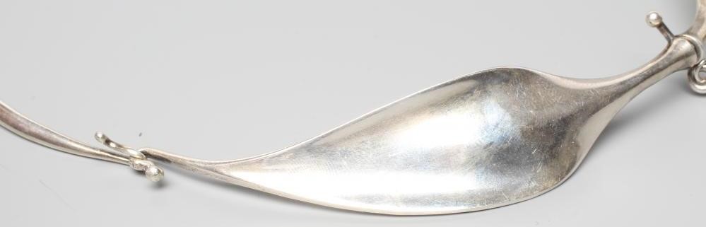 A GEORG JENSEN SILVER NECK RING designed by Viviana Torun Bulow-Hube Image