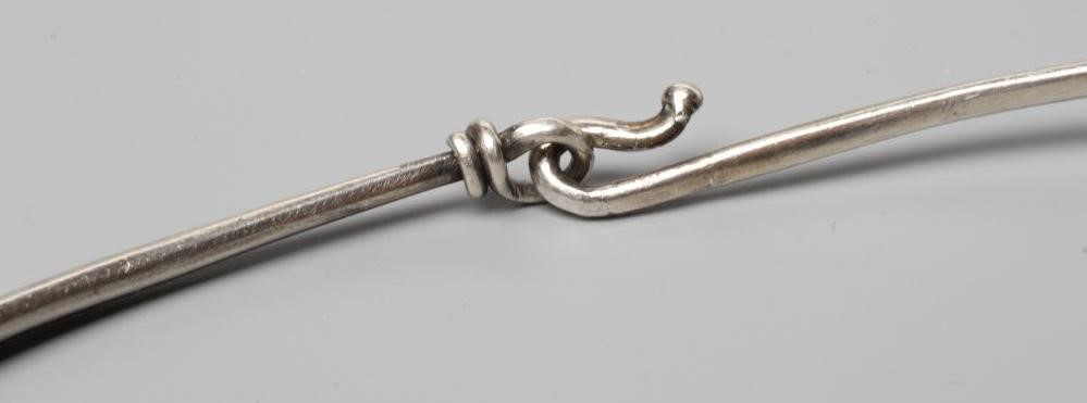 A GEORG JENSEN SILVER NECK RING designed by Viviana Torun Bulow-Hube Image