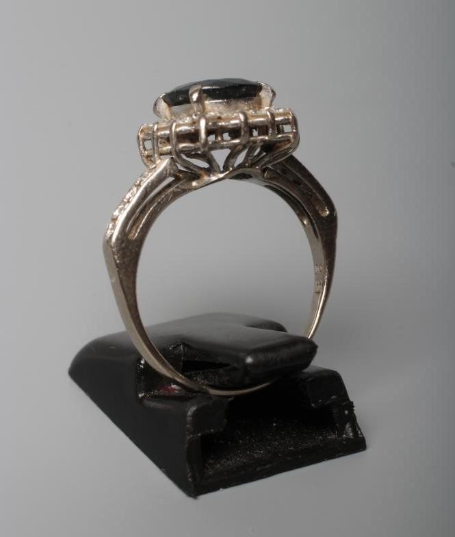 A SAPPHIRE AND DIAMOND CLUSTER RING Image