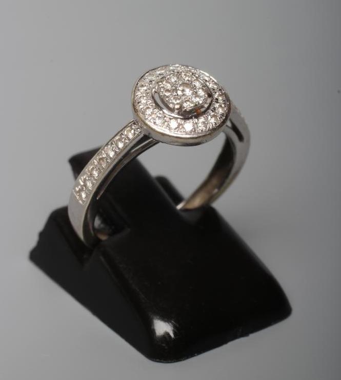 A DIAMOND TARGET RING Image