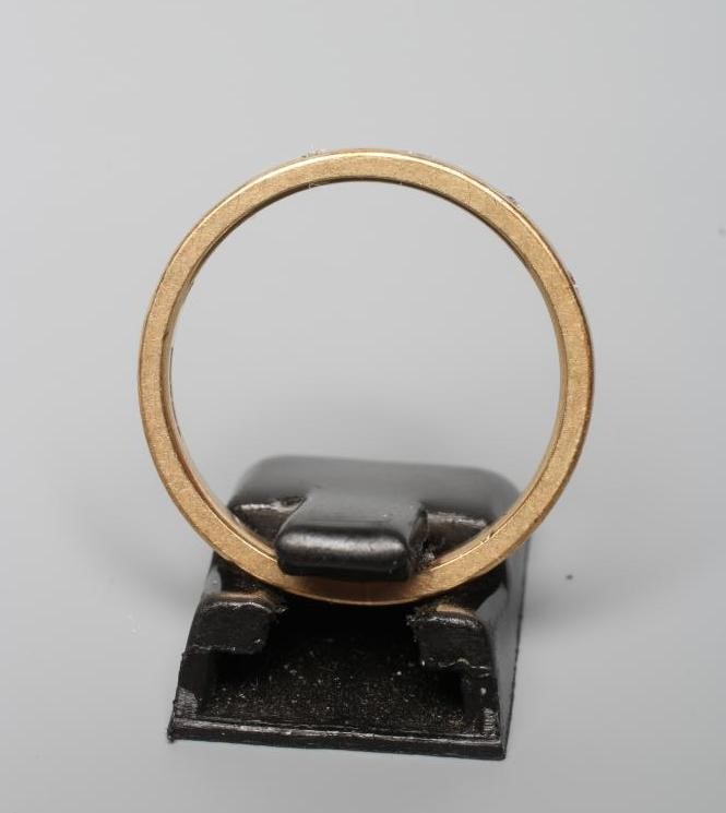 A DIAMOND SET WEDDING RING, the plain 9ct gold band gypsy set with six brilliant cut stones, Image